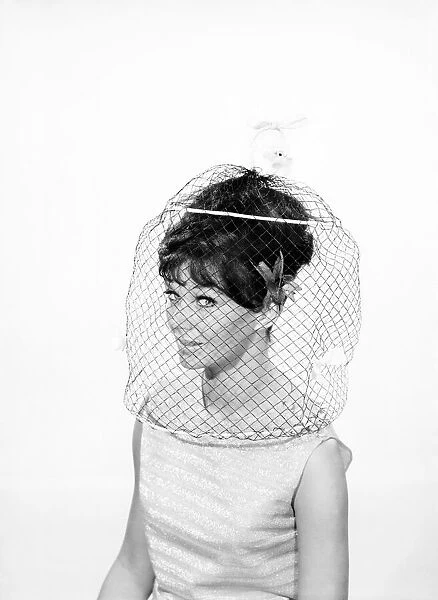 Clothing: Fashion: Hats: Woman wearing hats with veils. 1962 B1544-016