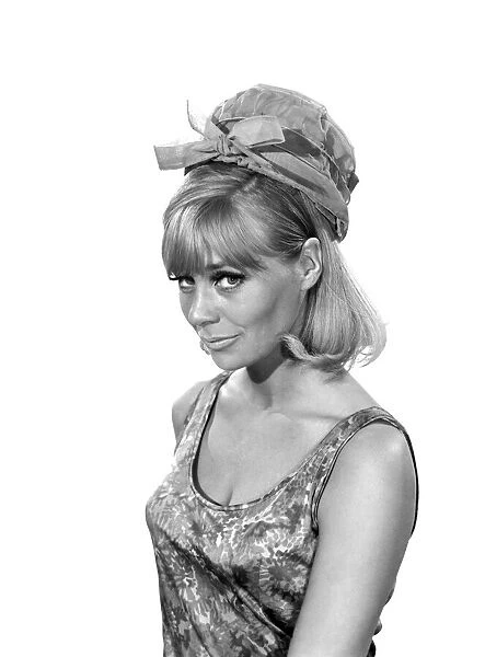 Clothing: Fashion: Hats: Woman wearing umbrella hat. Model: Marilyn Rickard. 1966 B2021