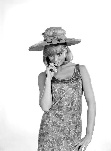Clothing: Fashion: Hats: Woman wearing umbrella hat. Model: Marilyn Rickard