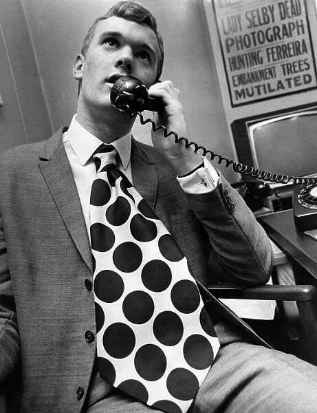 Clothing Fashion Menswear: Bob Reynolds wearing outsize tie. November 1966 P021957
