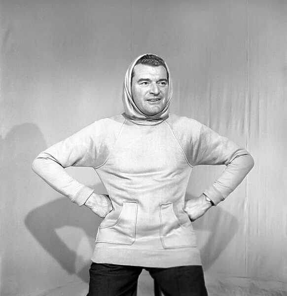 Clothing: Fashion: Menswear. Man wearing hooded sweat shirt. 1958 B116