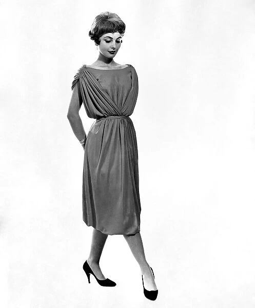 Clothing Fashion. Model wearing a belted evening dress. September 1958 P006905