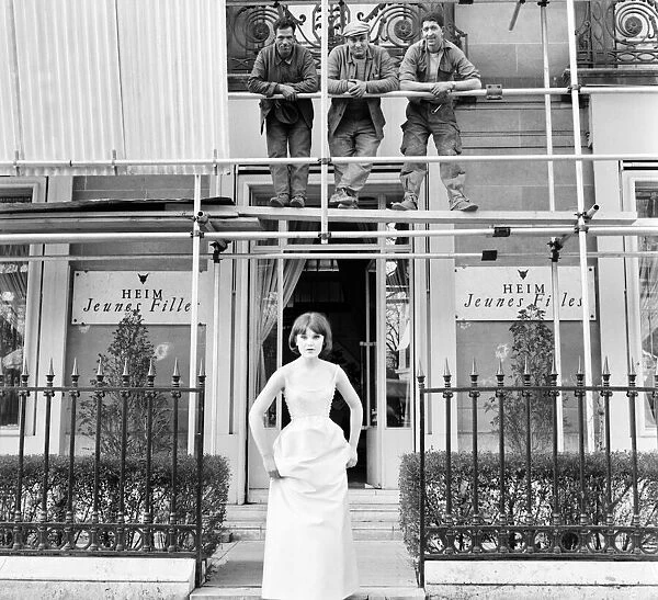 Clothing: Fashion: Paris: Woman modelling dress outside the Paris fashion house of