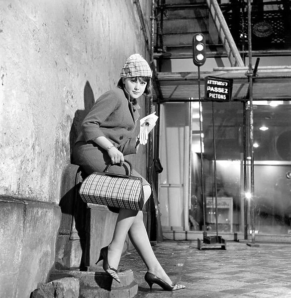 Clothing: Fashion: Paris: Woman modelling the latest 1963 French clothes designs in Paris