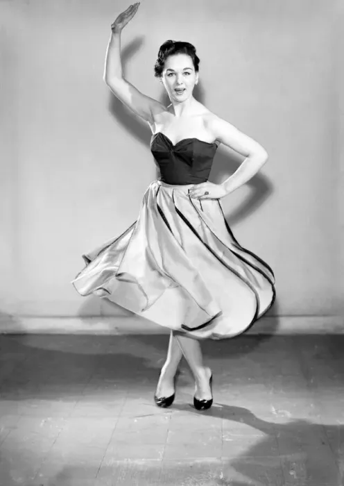 Framed Print : Clothing: Fashion: Skirt: Woman wearing leaf skirt. Model: Jackie Curtis. 1957 B480-001