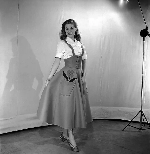 Clothing: Fashion: Skirts model wearing felt skirt. October 1953 D5999-001