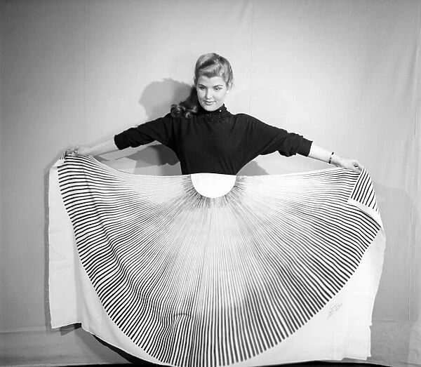 Clothing: Fashion: Skirts: Woman wearing pleated skirt. 1953 B127