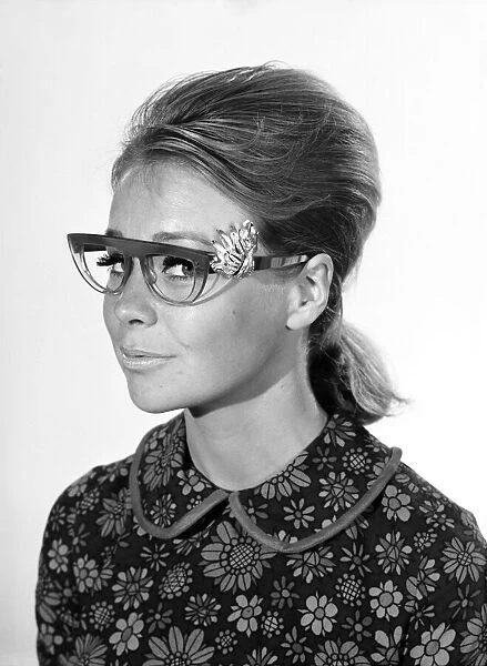 Clothing: Fashion: Spectacle Frames: Woman seen here modelling the latest fashionable