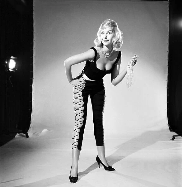 Clothing: Fashion: Tights. Model Peggy Moran seen here wearing laced tights