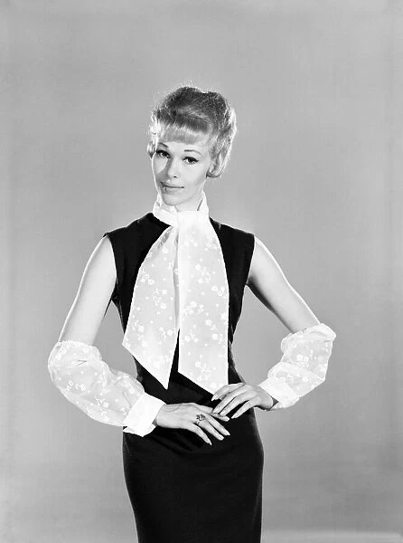 Clothing: Fashion: Woman wearing cravat and sleeves. Model: Jo Warring. March 1963 B1492