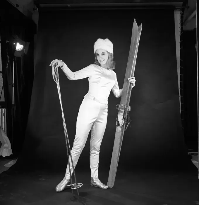 Framed Print : Clothing: Fashion: Woman wearing skiing outfit converted from wedding dress. 1963 B1578a Framed Print : Clothing: Fashion: Woman wearing skiing outfit converted from wedding dress. 1963 B1578a