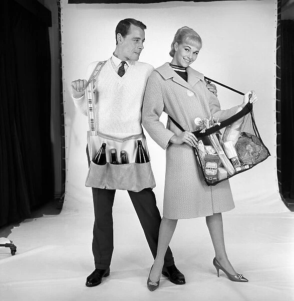 Clothing: Man and woman wearing matching aprons. 1960 B1255-004