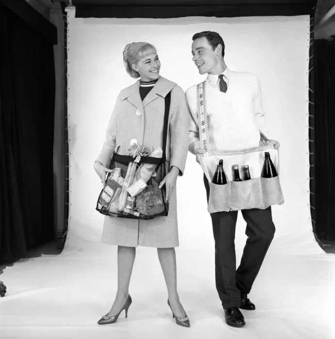 Framed Print : Clothing: Man and woman wearing matching aprons. 1960 B1255