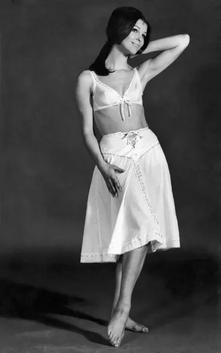 Framed Print : Clothing Underwear. Model wears a bra and knickers skirt. May 1970 P018280