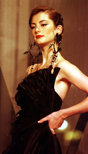 Clothing by Valentino 1998 Model wearing black evening dress clothing designed by