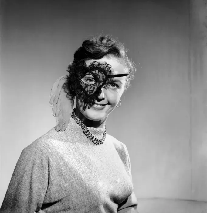 Framed Print : Clothing: Woman wearing party mask. 1955 B89
