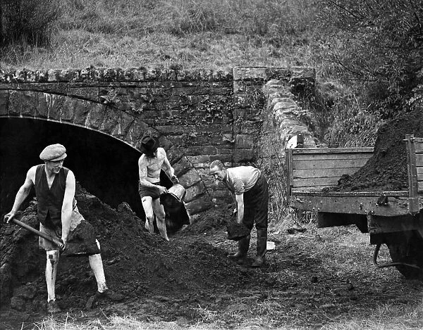 The coal is dredged in buckets from the bed of Sir Hony River at Fontllanfraith