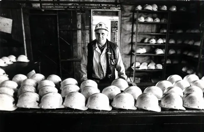 Framed Print : Coal - Miners - Coal miner checks the miners hats at a South Wales Colliery Framed Print : Coal - Miners - Coal miner checks the miners hats at a South Wales Colliery