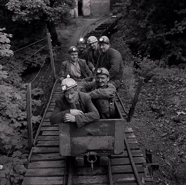 Coal Miners of Guyderbottom pit one of the smallest in the country seen here traveling
