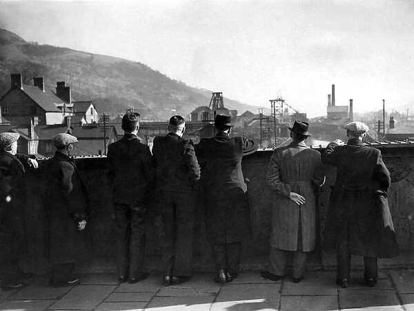 Coal Strike. Miners, now idle, looking from a bridge at a Colliery at Mountain Ash