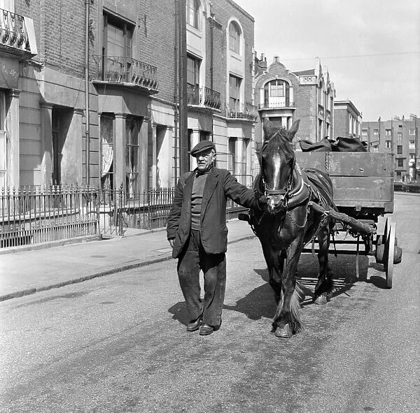 Coalman Mr Nightingale delivering coal. 25th April 1955