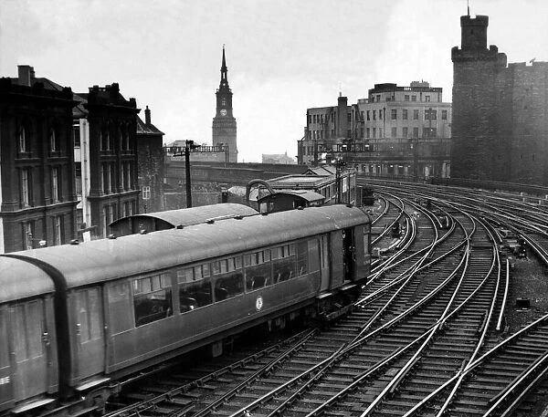A coast train pulls into Newcastle Central Station on 28th July 1962