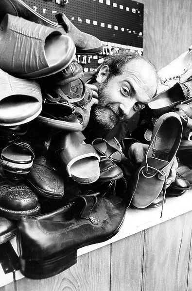 Cobbler Derek Croasdale wishes the boots in his shop would do some walking back to thie