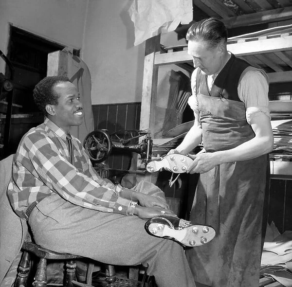 Cobbler seen here making a pair of mens shoes. December 1953 D7262