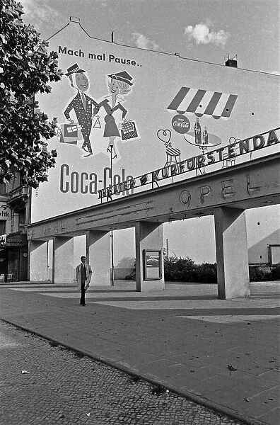 A Coca Cola advertising hoarding at the entrance to the Kurfurstendamm theatre, Berlin