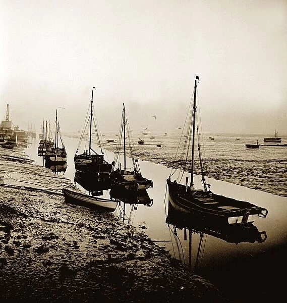 Cockle fishing boats moored in an estuary near the east coast of England. 1963