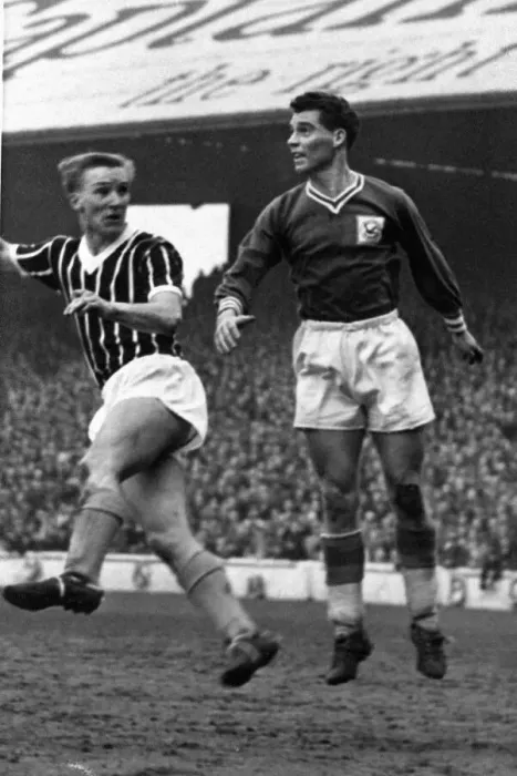 Framed Print : Colin Baker of Cardiff City leaps to clear the ball during a League Division One match Framed Print : Colin Baker of Cardiff City leaps to clear the ball during a League Division One match