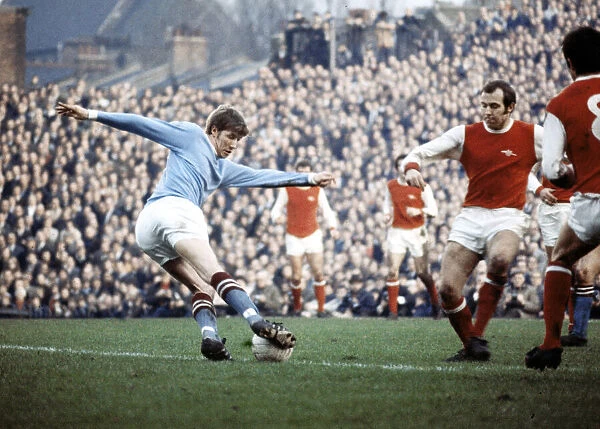 Colin Bell in action for Manchester City against Arsenal during their English League