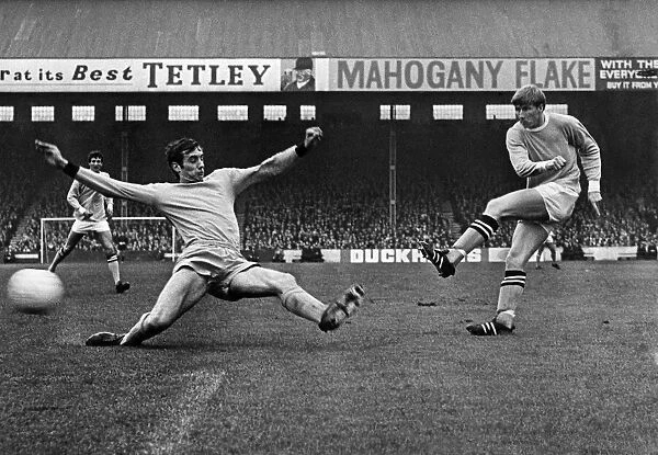 Colin Bell of Manchester City shoots at goal but the Wolves defender blocks the ball