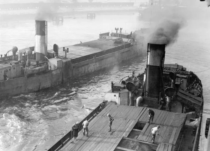 Framed Print : The collier ship Fulham II moves down the River Tyne at Dunston Staithes passing another Framed Print : The collier ship Fulham II moves down the River Tyne at Dunston Staithes passing another