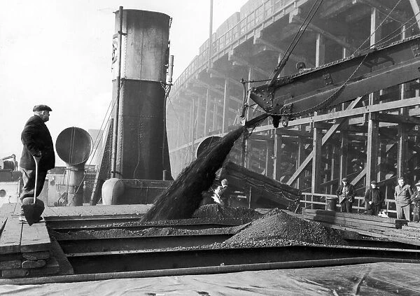 The collier ship Fulham being loaded with coal on the River Tyne at Dunston Staithes in