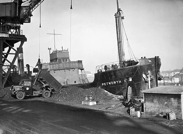 The Collier SS Petworth unloading her cargo of coal at Soreham gasworks, Sussex