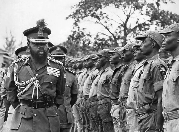 Colonel Odumegwu Ojukwu, the Military Governor of Biafra in Nigeria inspecting some of