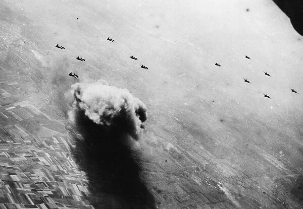 A column of smoke rising several thousand feet in the air over Busigny in occupied France