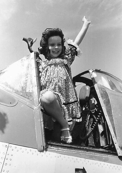 Come Fly With Me. Little Lucy Deplidge seen here waving from the cockpit of a Fleet Air