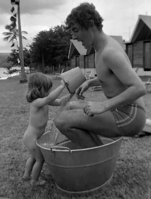 Framed Print : Comedian, actor and publisher Peter Cook with daughter Lucy during a holiday in Grenada Framed Print : Comedian, actor and publisher Peter Cook with daughter Lucy during a holiday in Grenada