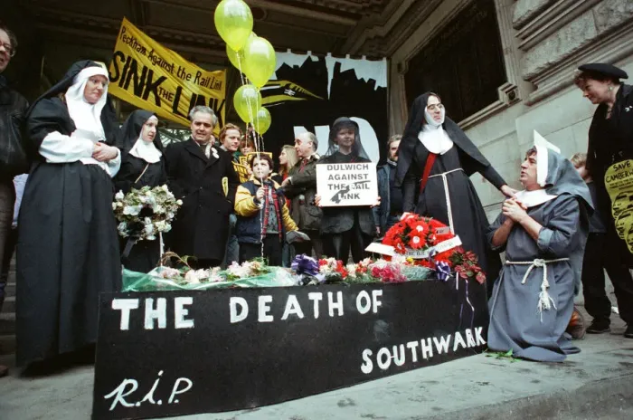 Framed Print : Comedian and actor Terry Jones takes part in a rail tunnel protest outside Waterloo