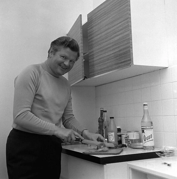 Comedian Benny Hill in his flat in the kitchen May 1969