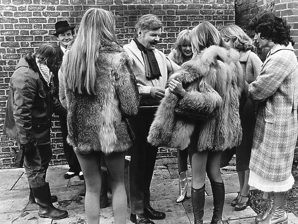 Comedian Benny Hill with girls during filming 1978