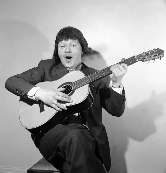 Framed Print : Comedian Benny Hill pictured at home wearing a wig and playing the guitar May 1958 Framed Print : Comedian Benny Hill pictured at home wearing a wig and playing the guitar May 1958