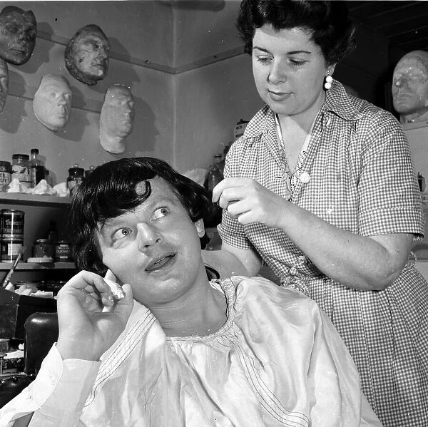 Comedian Benny Hill seen here having a wig fitted in the make up workshop