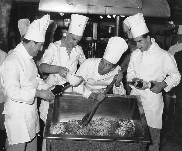 Comedian Frankie Howerd seen here giving the chefs of an unnamed Coventry hotel a hand in