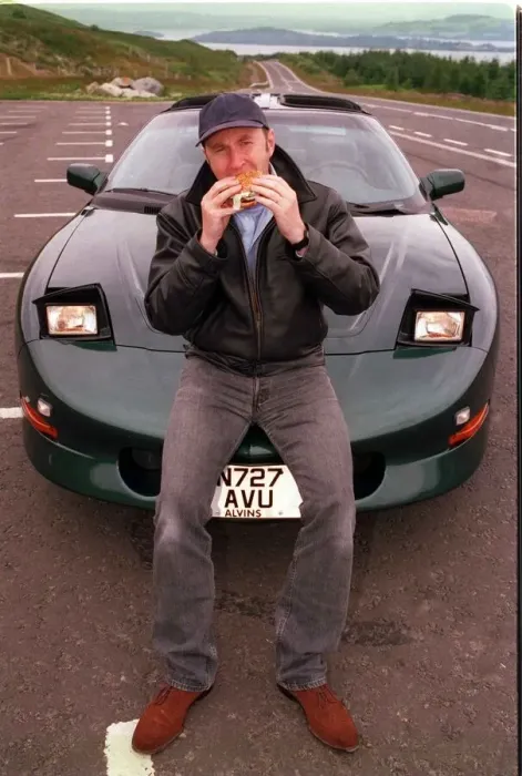 Framed Print : COMEDIAN Fred MacAulay WITH SUPER CAR TRANS AM EATING A HAMBURGER Framed Print : COMEDIAN Fred MacAulay WITH SUPER CAR TRANS AM EATING A HAMBURGER