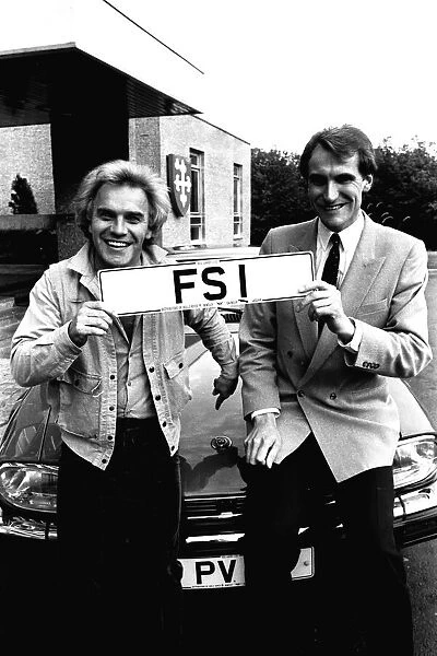 Comedian Freddie Starr receives the plates for his new car, a Jaguar XJS HE