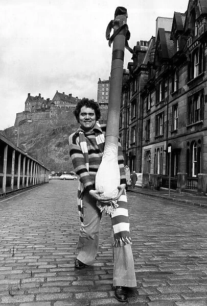 Comedian Max Boyce carrying a giant leek in Edinburgh, during his tour of Scotland circa