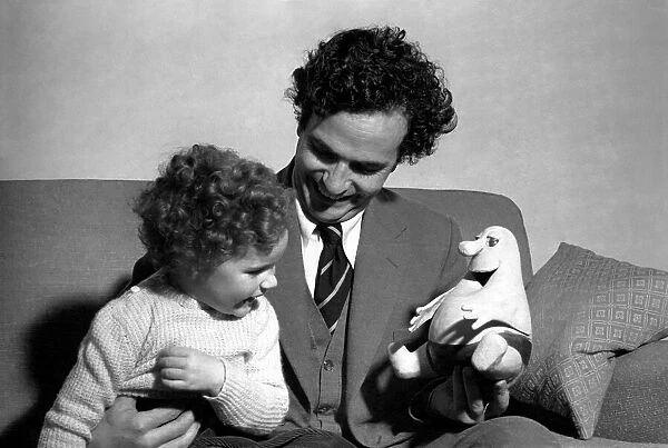 Comedian Michael Bentine seen here with a Bumble puppet and his son Gus